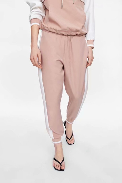 Pantaloni sport de dama cu talie elastica in roz si margine laterala