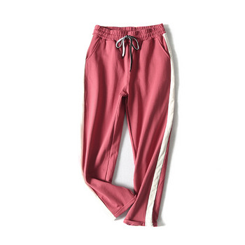 Дамски спортни панталони в черен и розов цвят с кант