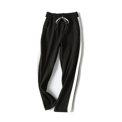 Pantaloni sport de damă în negru și roz cu margini