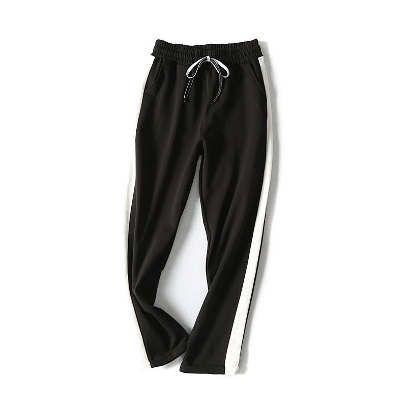 Pantaloni sport de damă în negru și roz cu margini