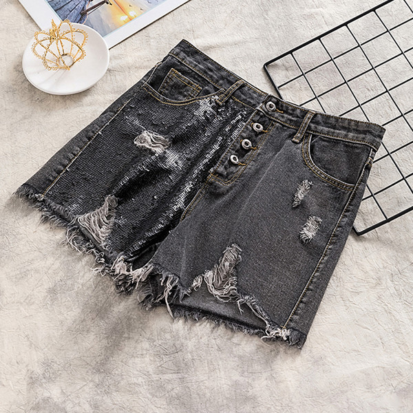 Pantaloni scurți de damă din denim cu paiete și motive rupte