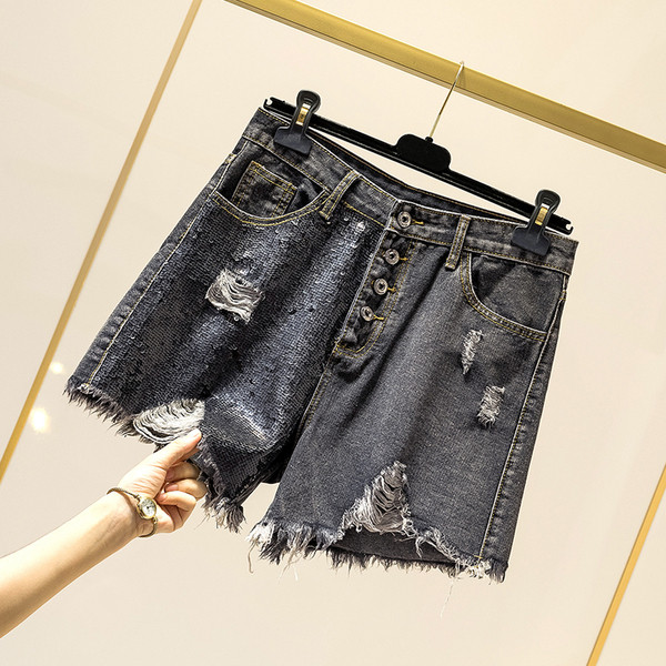 Pantaloni scurți de damă din denim cu paiete și motive rupte