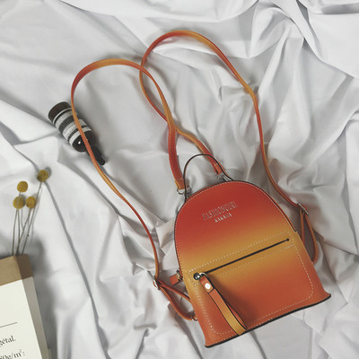 Rucsac modern de damă cu o inscripție în roz, galben și negru