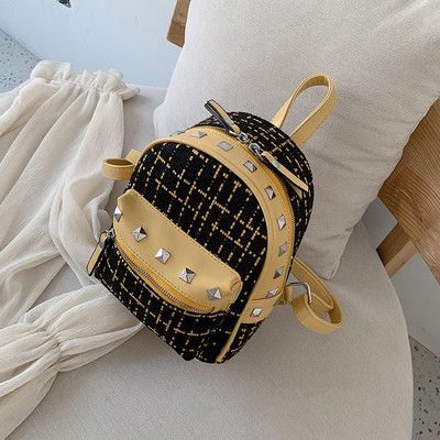 Rucsac modern de dama cu buzunar frontal si elemente metalice in mai multe culori