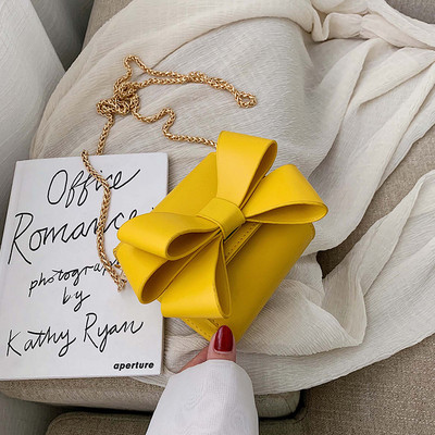 Модерна дамска чанта с панделка и метална дръжка в няколко цвята