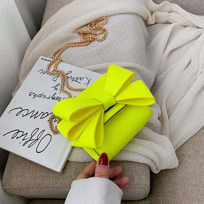 Модерна дамска чанта с панделка и метална дръжка в няколко цвята