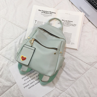 Női alkalmi hátizsák öko bőrből, elülső zsebekkel több színben