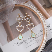 Model nou de cercei dama - cu perle decorative