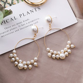 Cercei de dama actuali cu forma rotunda - in culoare aurie