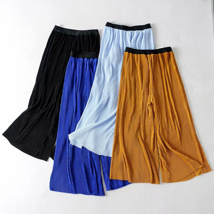 Pantaloni dama plisati cu lungime de 7/8 si talie elastica de culoare galbena