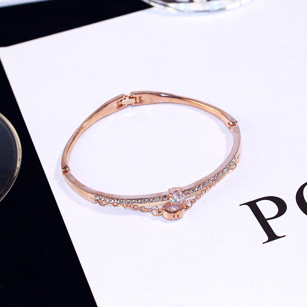 Bratara eleganta de dama de culoare aurie cu pietre