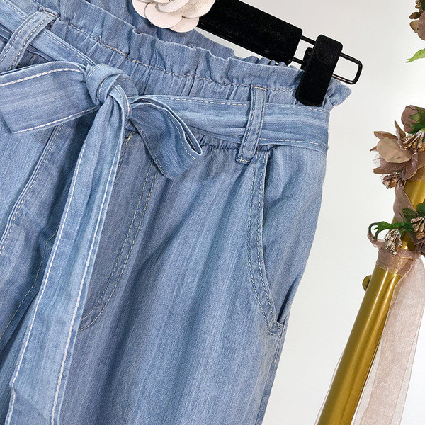 Pantaloni largi de damă din denim cu legături în talie în albastru