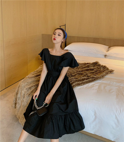 Model de rochie de dama cu croiala moderna in alb si negru