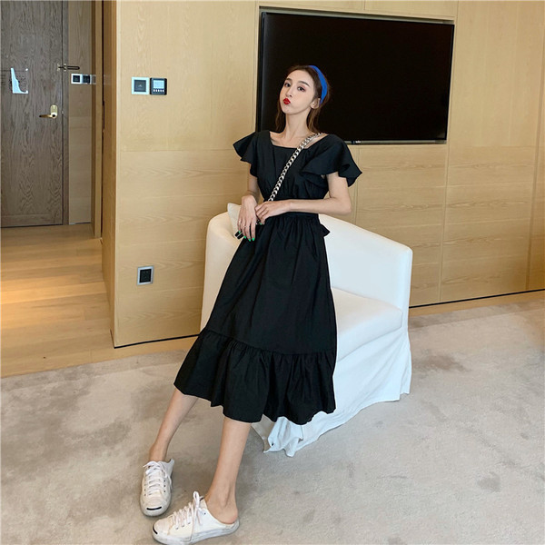 Model de rochie de dama cu croiala moderna in alb si negru