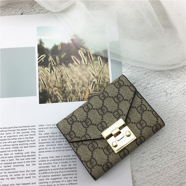 Portofel de dama modern cu decor metalic