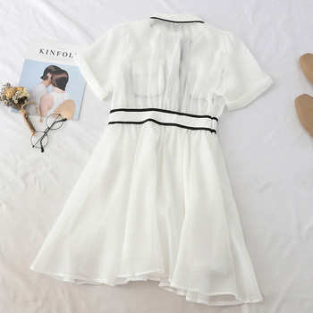 Stílusos női ruha gallérral és rövid ujjú fekete-fehér színben