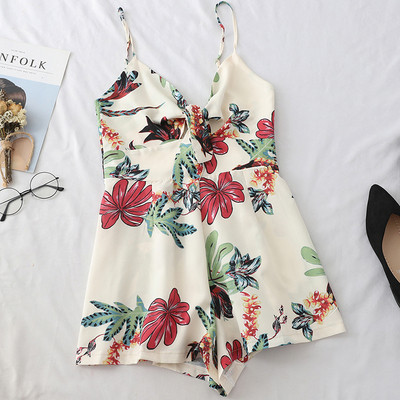 Καλοκαιρινή γυναικεία ολόσωμη φόρμα  με λεπτούς ιμάντες ώμου και φυτικά μοτίβα σε λευκό και μπλε χρώμα