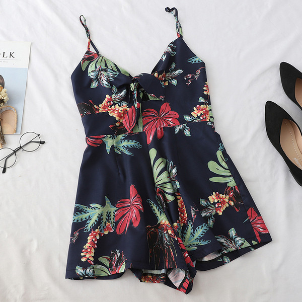 Καλοκαιρινή γυναικεία ολόσωμη φόρμα  με λεπτούς ιμάντες ώμου και φυτικά μοτίβα σε λευκό και μπλε χρώμα