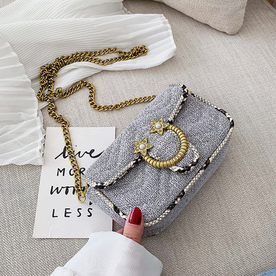 Geanta de dama moderna cu element metalic si lant