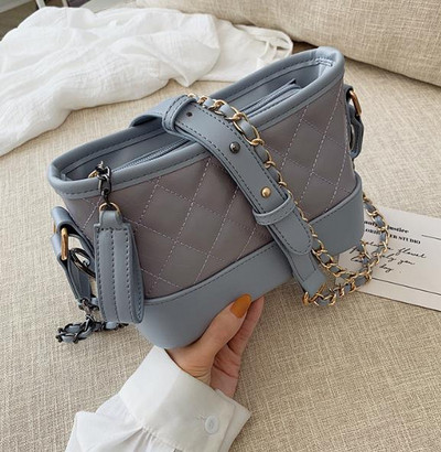 Eko bőrből készült alkalmi női táska két színben, cipzárral