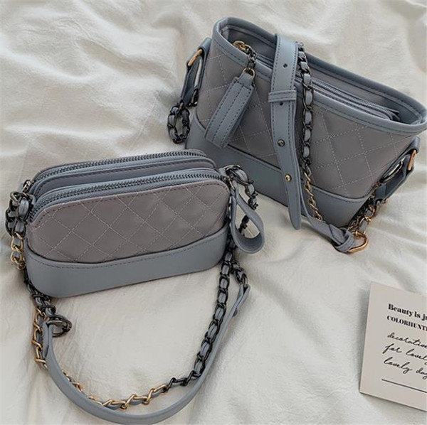 Eko bőrből készült alkalmi női táska két színben, cipzárral