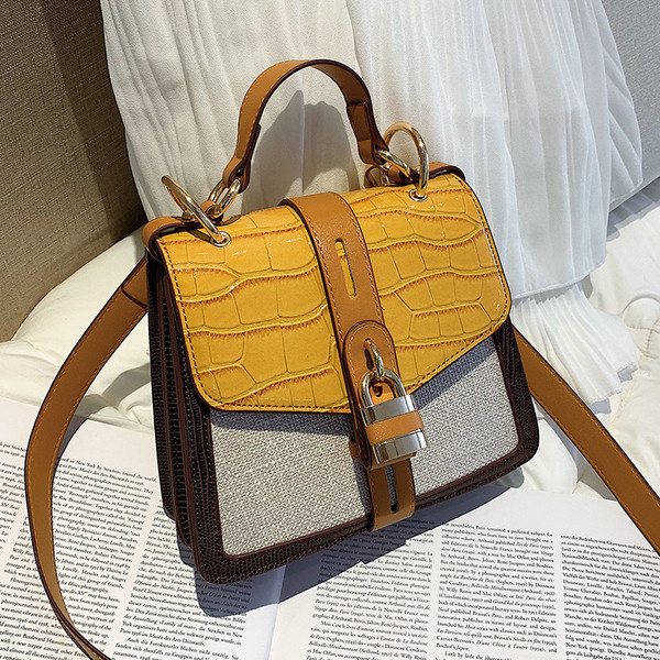 Geanta de dama moderna cu inchidere metalica in doua culori