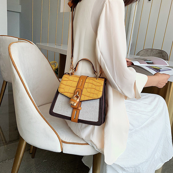 Geanta de dama moderna cu inchidere metalica in doua culori