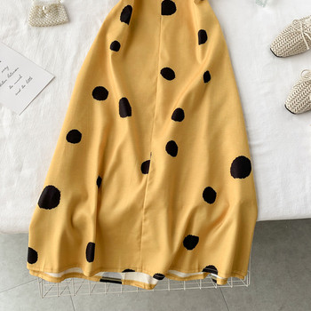 Дамска рокля на точки в жълт цвят и тънки презрамки