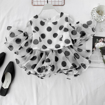 Bluză de damă cu buline cu fermoar în alb și negru