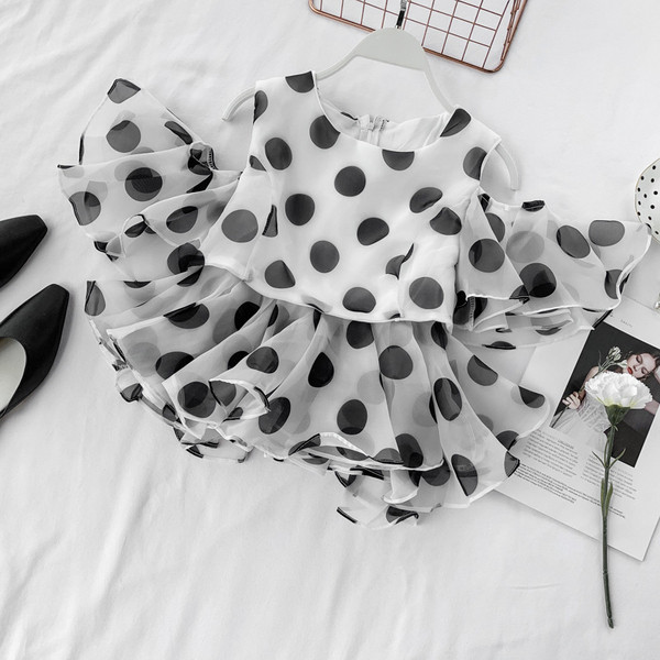 Bluză de damă cu buline cu fermoar în alb și negru