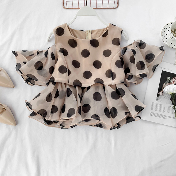 Bluză de damă cu buline cu fermoar în alb și negru