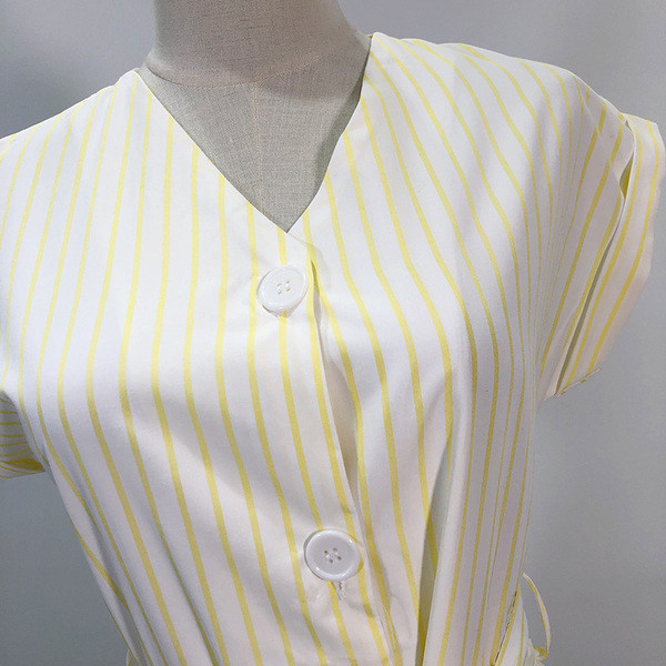 Γυναικεία ολόσωμη φόρμα με ζώνη μέσης και κουμπιά