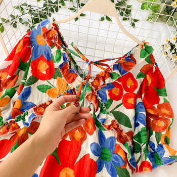 Модерна дамска рокля с флорален десен и връзки на гърба