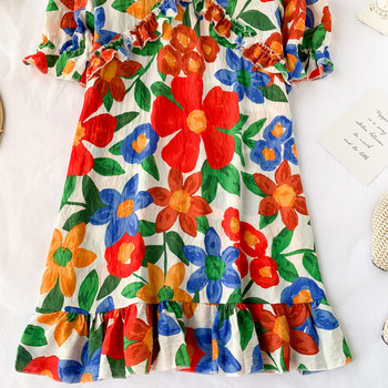 Модерна дамска рокля с флорален десен и връзки на гърба