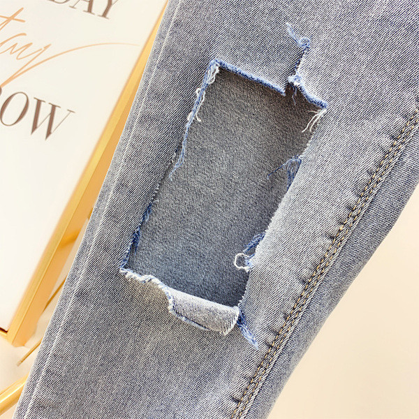 Blugi lungi de damă cu motiv rupt în albastru