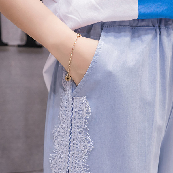 Pantaloni de dama la moda in albastru cu dantela