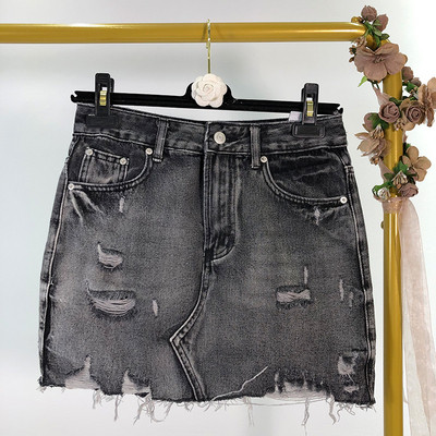 Fusta de dama din denim cu efect rupt in albastru si negru