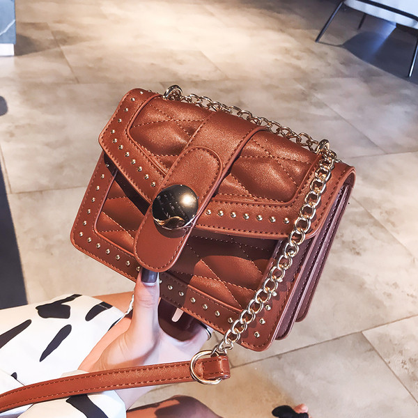 Geanta de dama cu maner metalic in patru culori