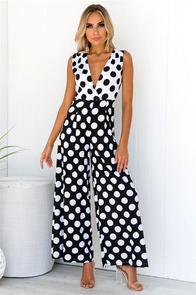 Salopetă lungă de damă cu buline în alb-negru