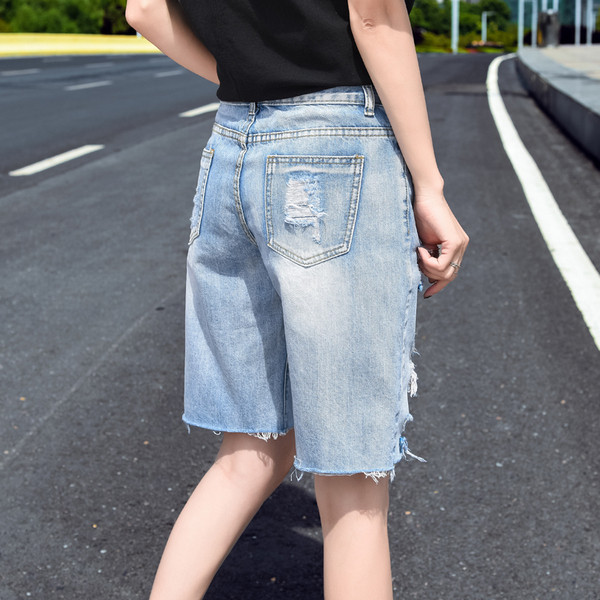 Pantaloni moderni de dama cu motive rupte lungime 3/4