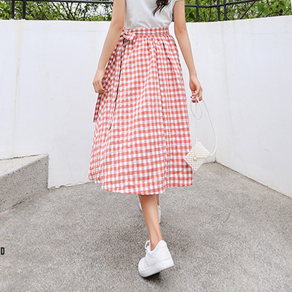 Актуална дамска разкроена карирана пола в два цвята с висока талия