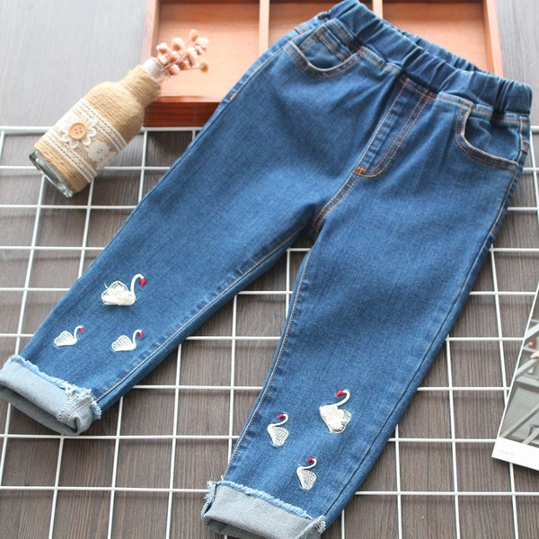 Blugi moderni pentru copii cu motive rupte in albastru pentru fete