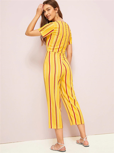 Κομψή γυναικεία ολόσωμη φόρμα με κοντό μανίκι σε κίτρινο χρώμα