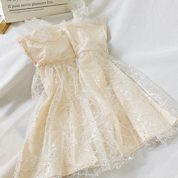 Model elegant de rochie de dama cu efect stralucitor in negru si bej