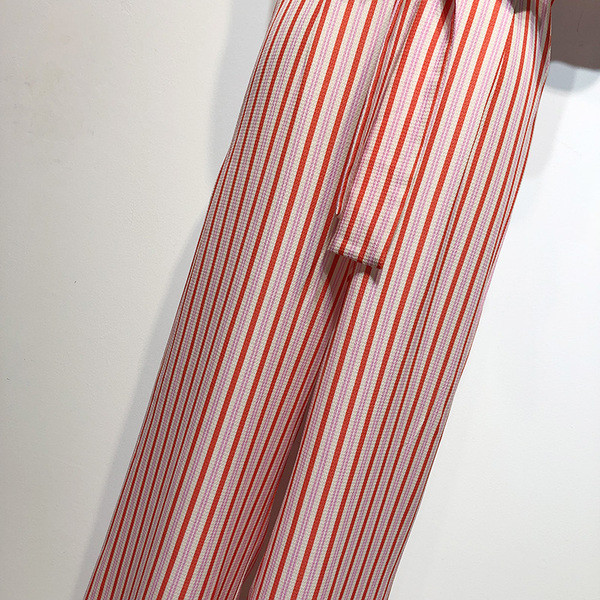 Salopetă de damă în dungi cu legături în talie