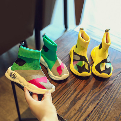Casual children`s sneakers suitable for girls and boys in yellow and green