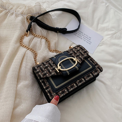 Modern női táska fém rögzítéssel és hosszú fogantyúval