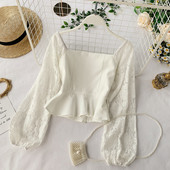 Bluză de damă elegantă cu mâneci din dantelă în alb-negru