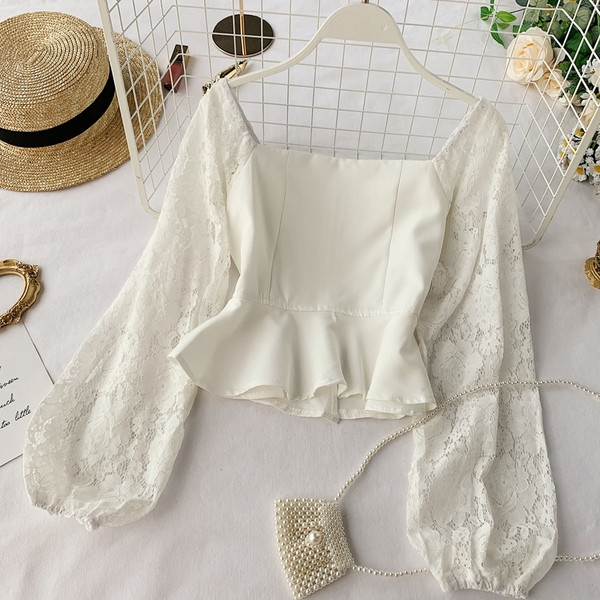 Bluză de damă elegantă cu mâneci din dantelă în alb-negru