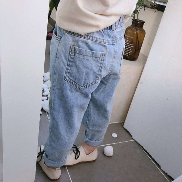 Модерни детски дънки за момичета със скъсани мотиви и апликации